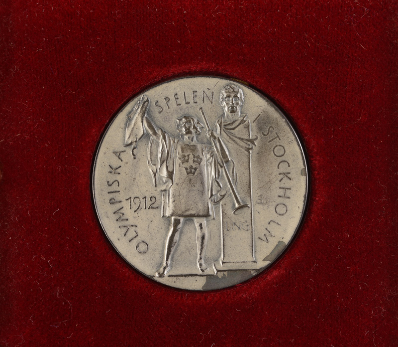 Personal silver rowing medal from the 1912 Stockholm Olympic Games; presented to Tom Gillespie