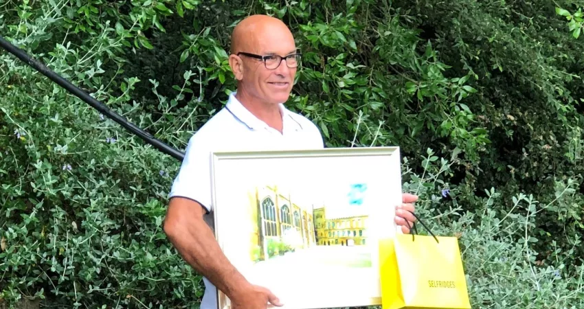 Steve is presented with gifts, including a painting of New College Front Quad
