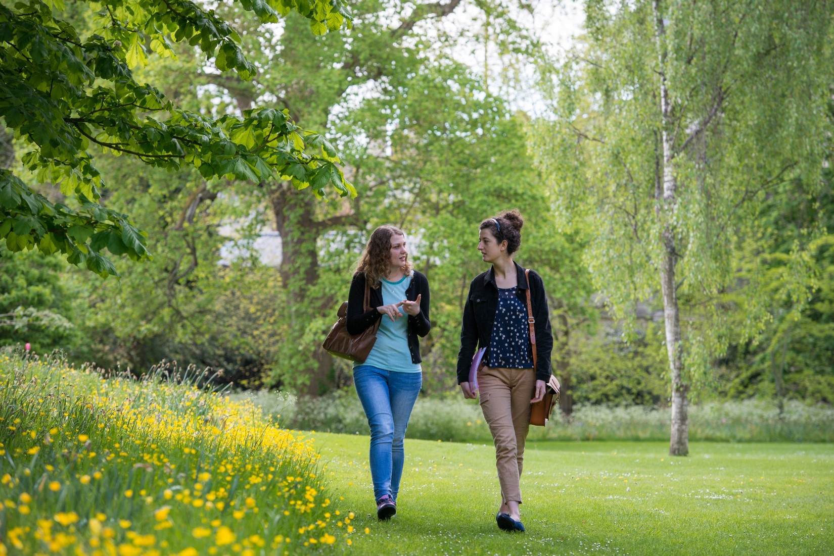 Students walking in the gardens Students walking in the gardens