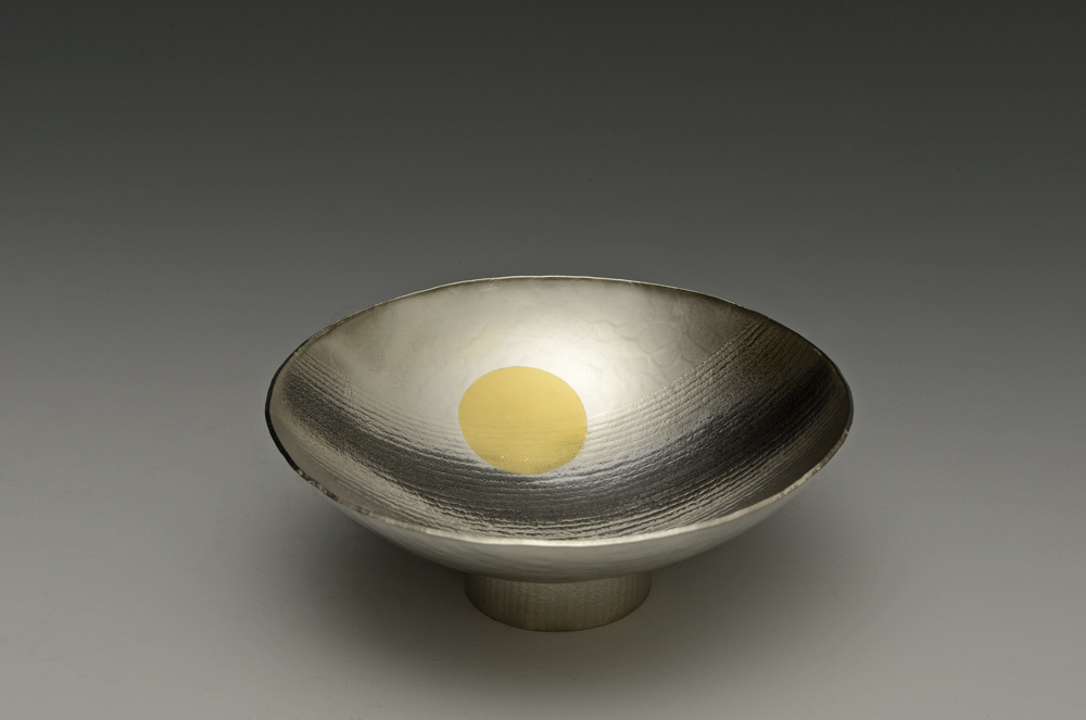 A Fingerbowl by Wayne Meeton: Brtiannia Silver with 18 carat gold detail and commissioned in 2013