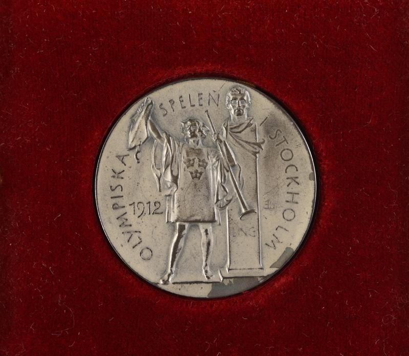 Personal silver rowing medal from the 1912 Stockholm Olympic Games; presented to Tom Gillespie and gifted to College by his family. Personal silver rowing medal from the 1912 Stockholm Olympic Games; presented to Tom Gillespie