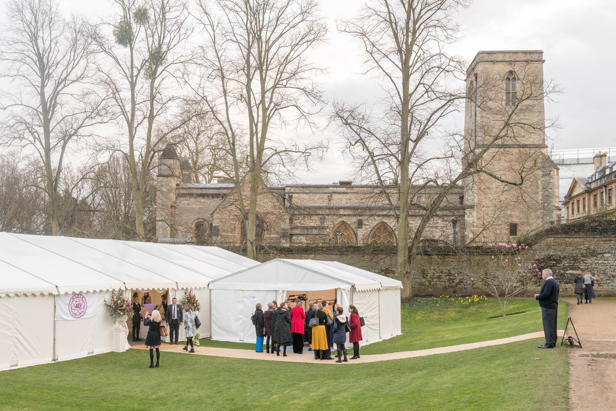 Attendees enter the marquee in the Gardens