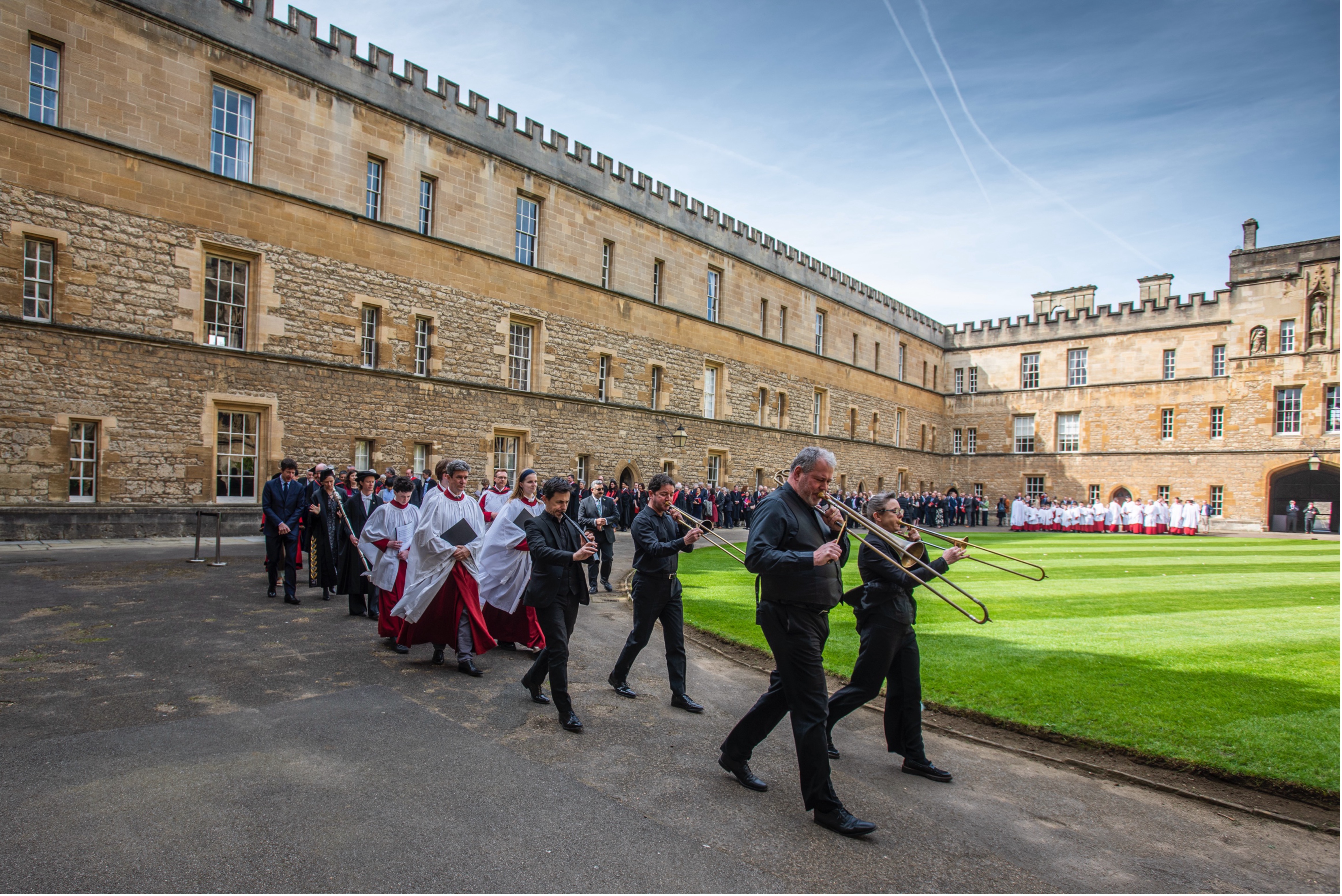 The procession leaves Front Quad, led by a brass quartet