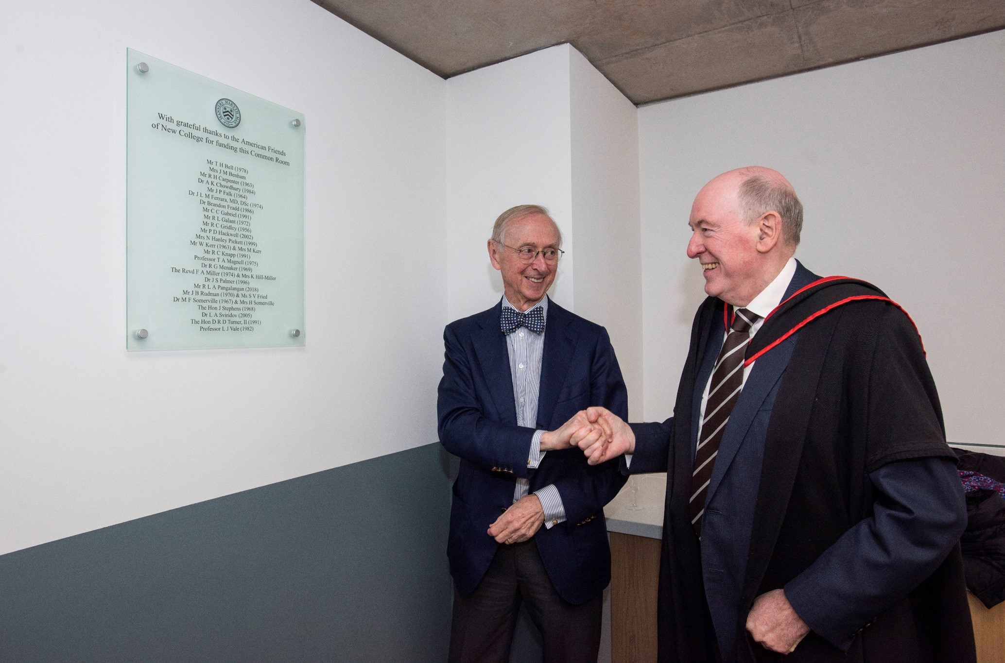 Bill Kerr examines the American Friends plaque in the student study space