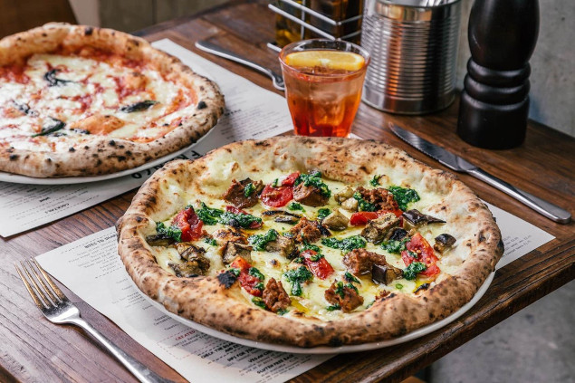 Franco Manca picture of a table with pizza and drink on