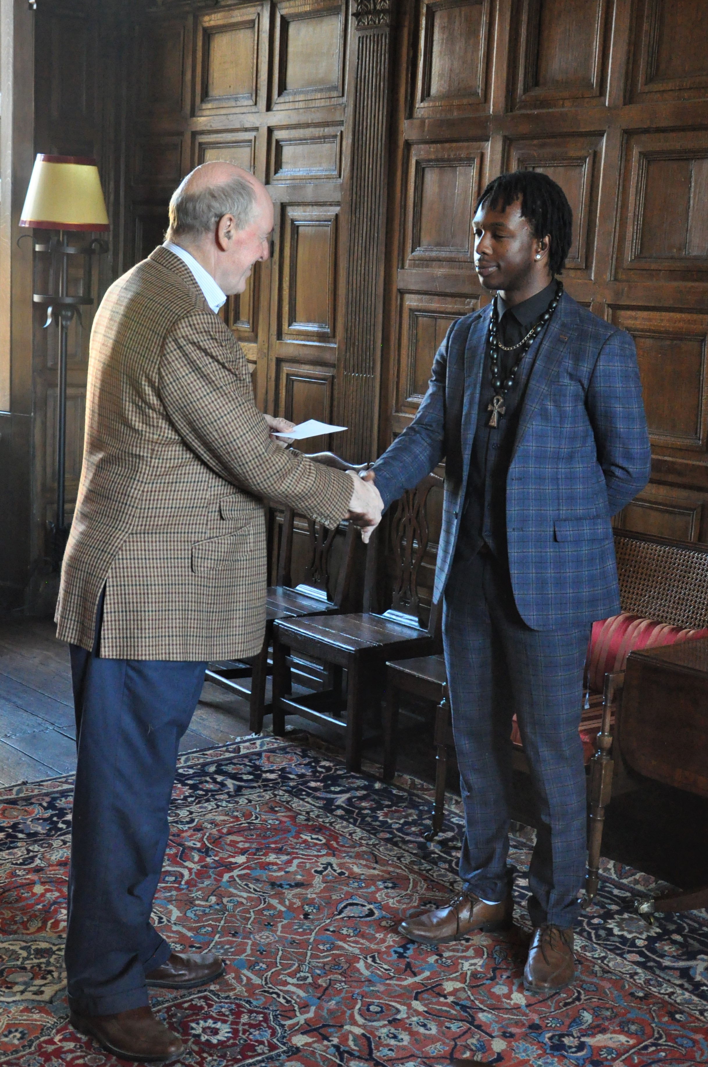 Kofi receiving his prize from the Warden