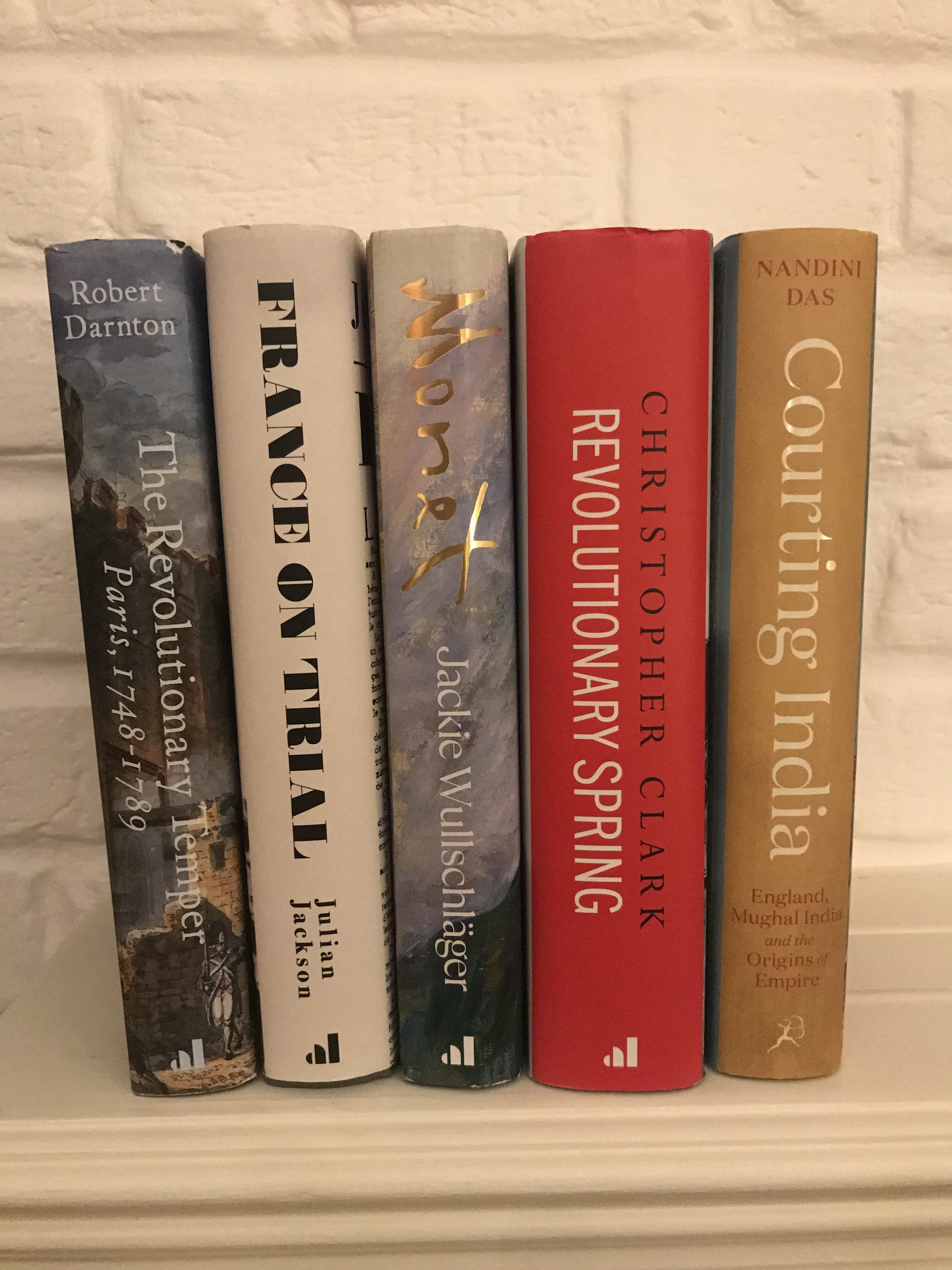The five shortlisted books on a shelf