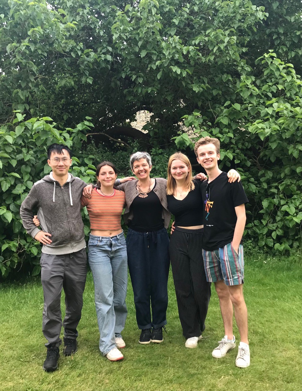 Yuyang Chen, Megan Macgillivray, a very proud Prof Ashleigh Griffin, Geena Goodwin and William Lunt. Trees in the background. 