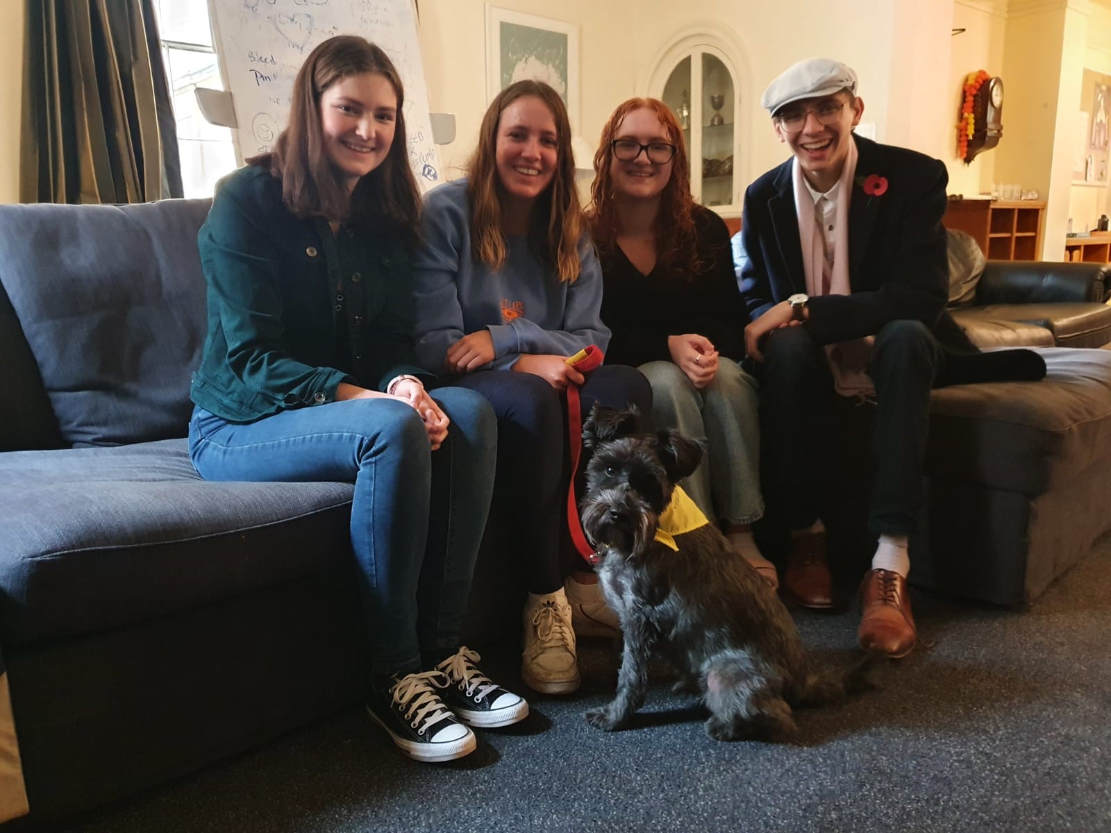 4 students with Eddy the miniature schnauzer