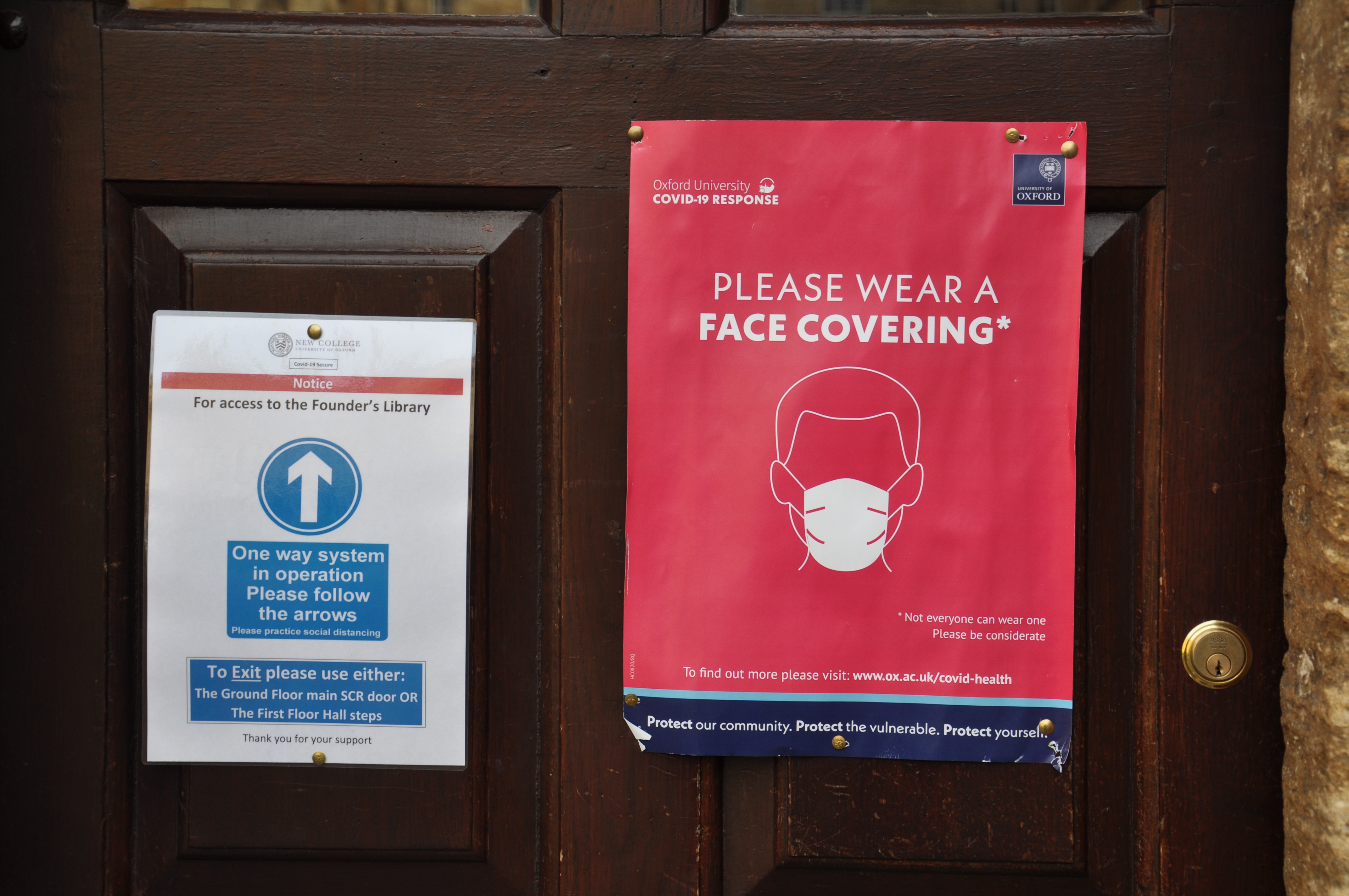 Sign on door, showing one way system and asking for face covering to be worn