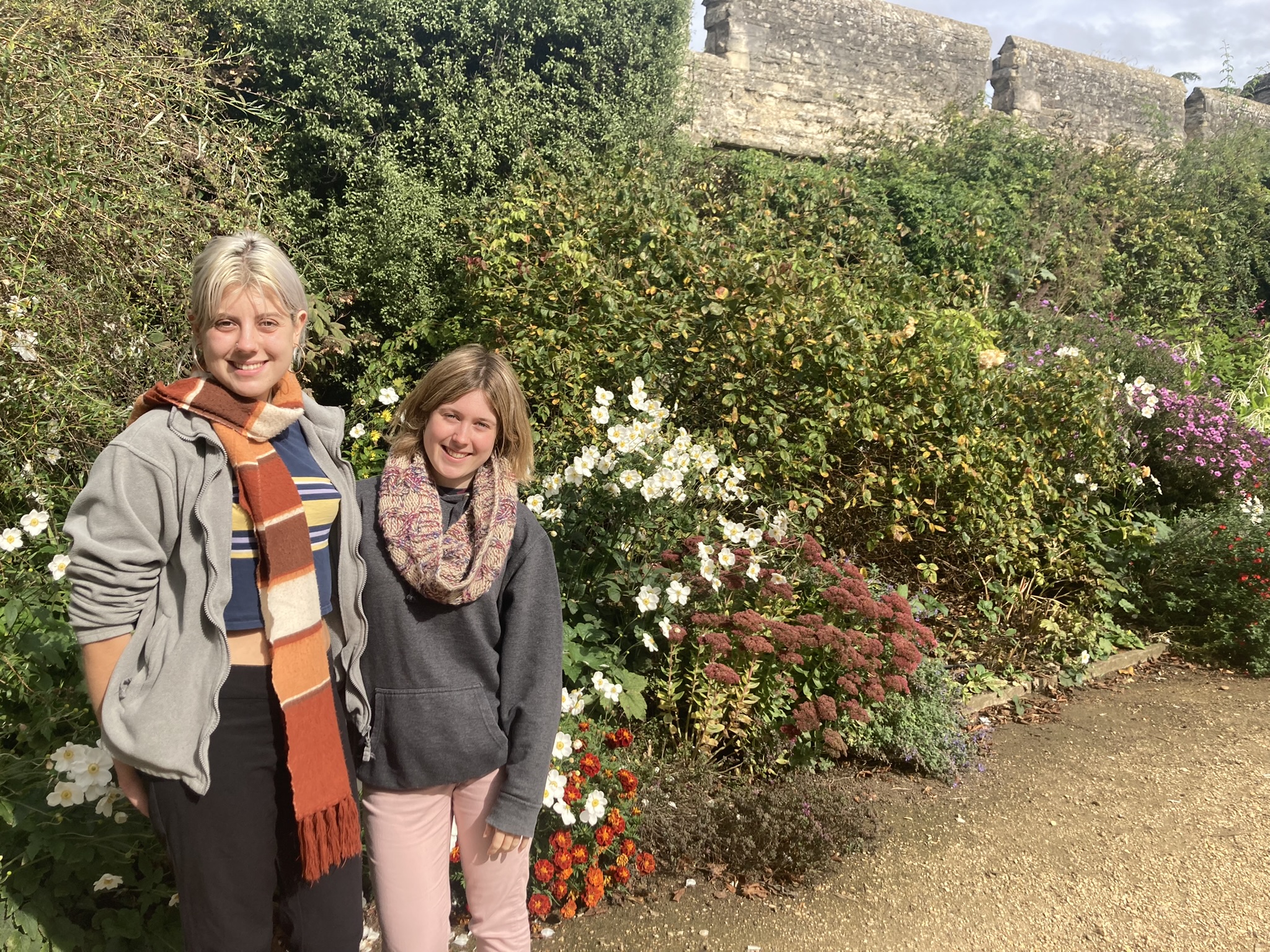 Danni and Maddie in front of the herbaceous border and City Wall