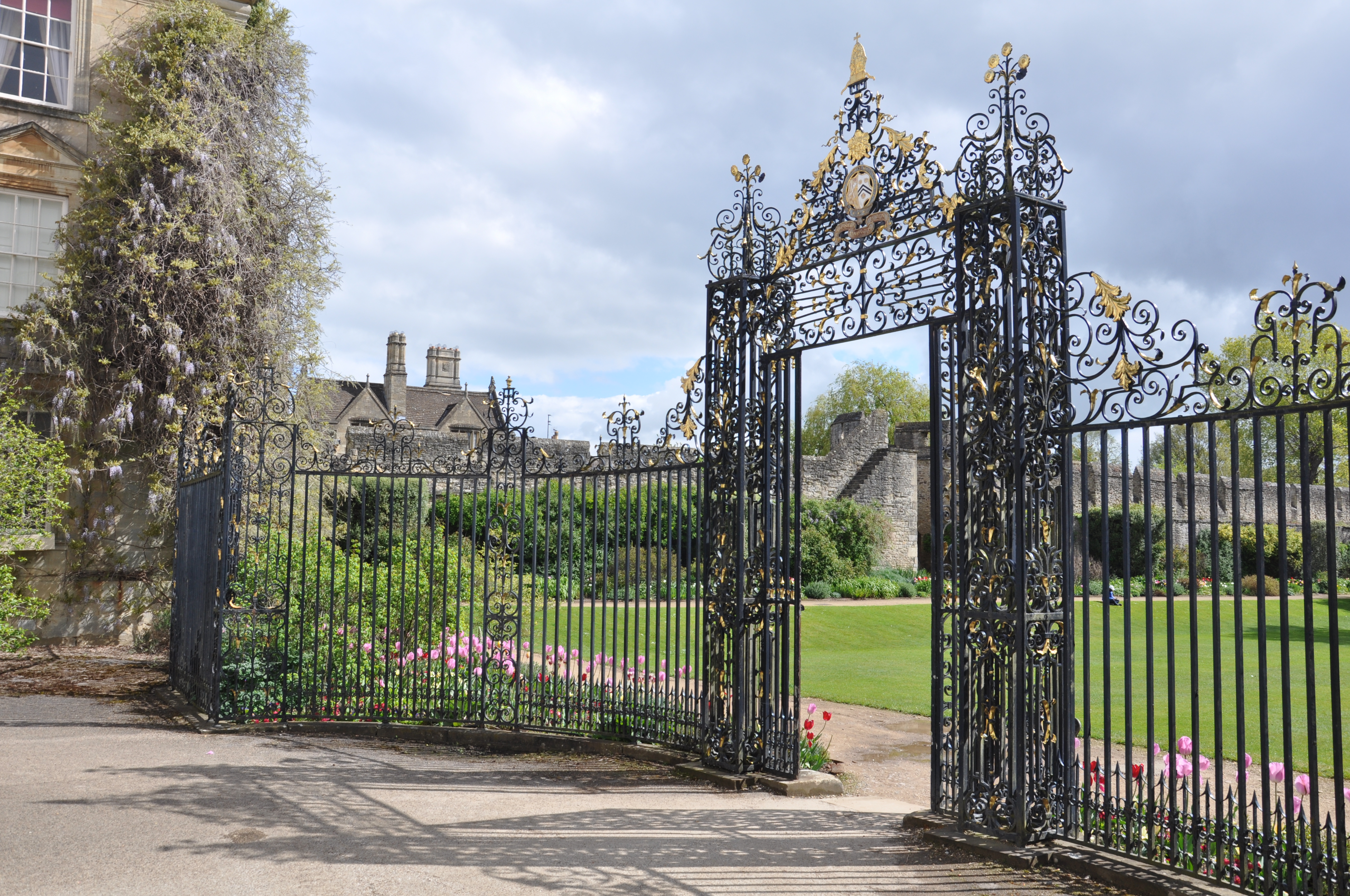 Iron screen with New College logo in Garden Quad