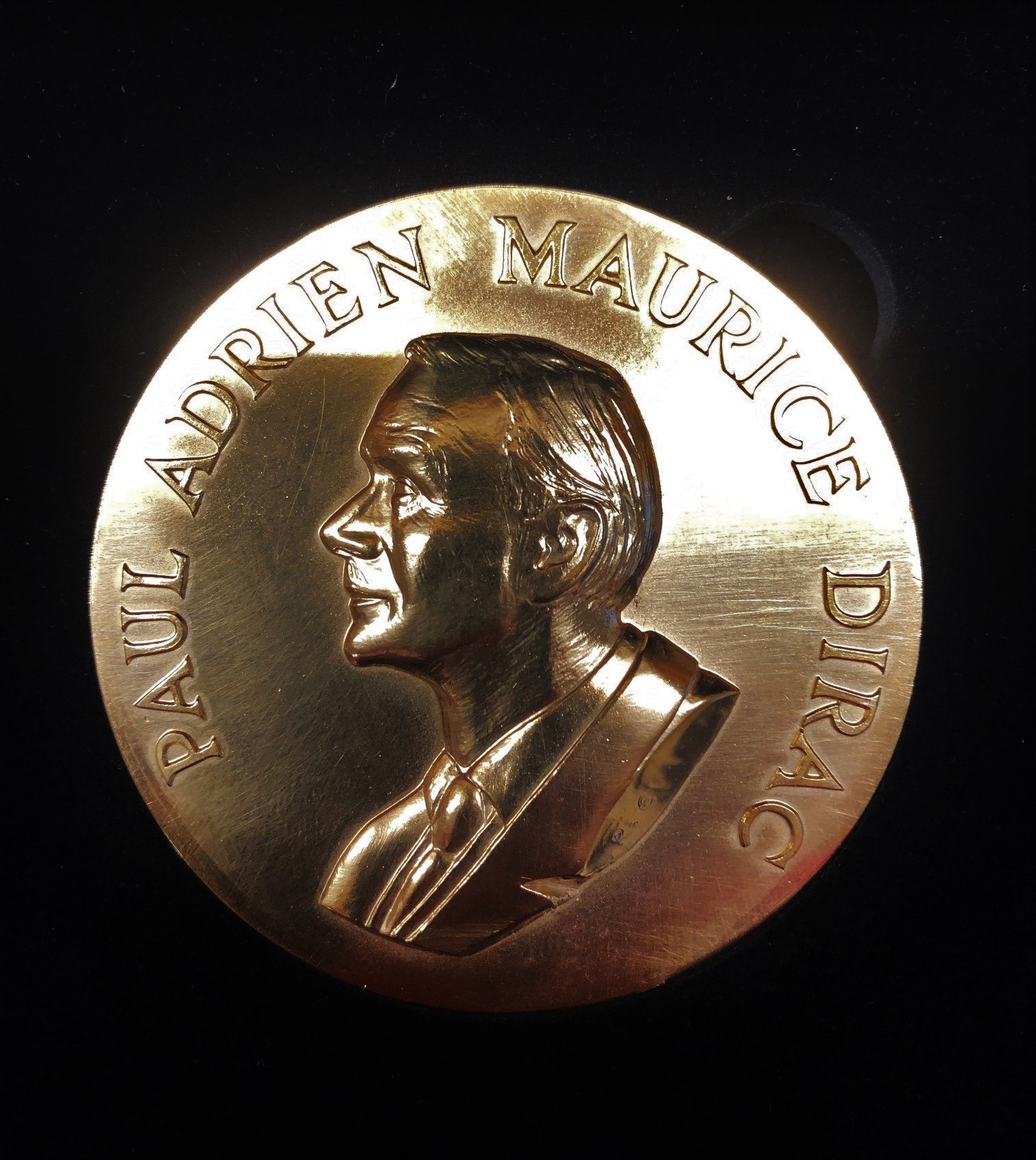 Silver medal reading 'Paul Adrien Maurice Dirac' with engraved portrait of Dirac