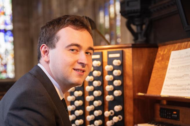 Donal McCann in front of an organ