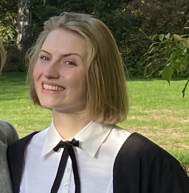 A woman smiling at the camera