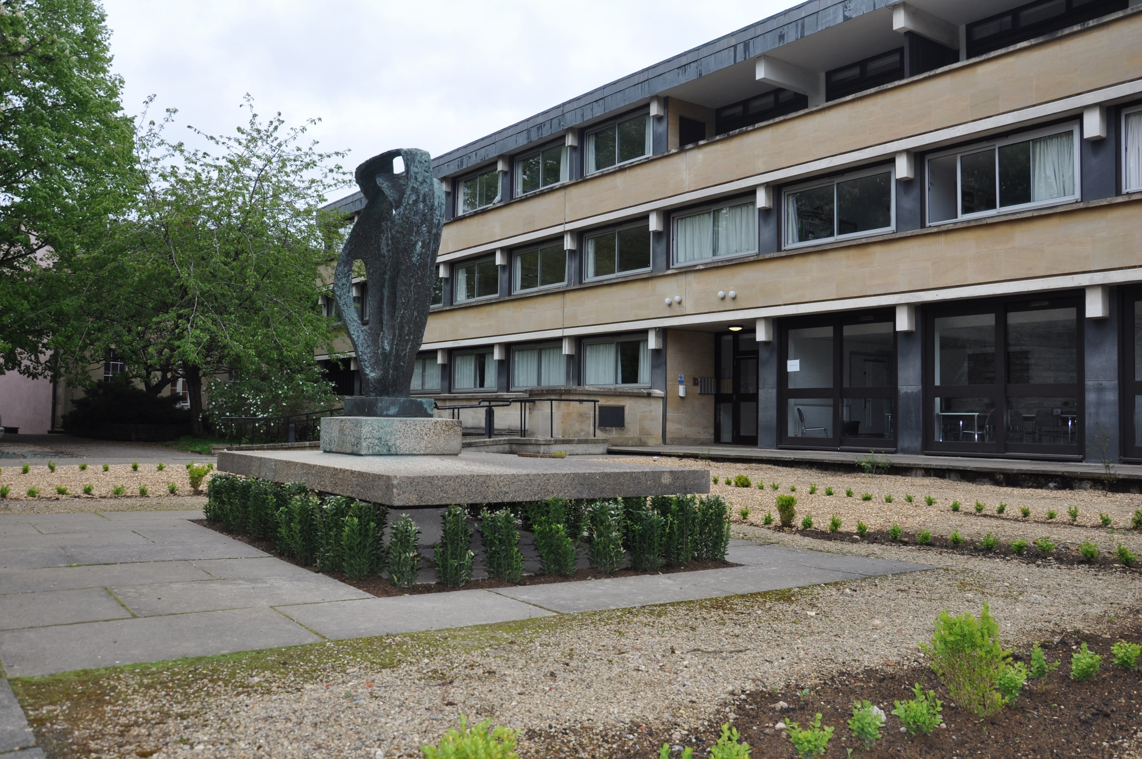 Hepworth sculpture in front of a 60s building