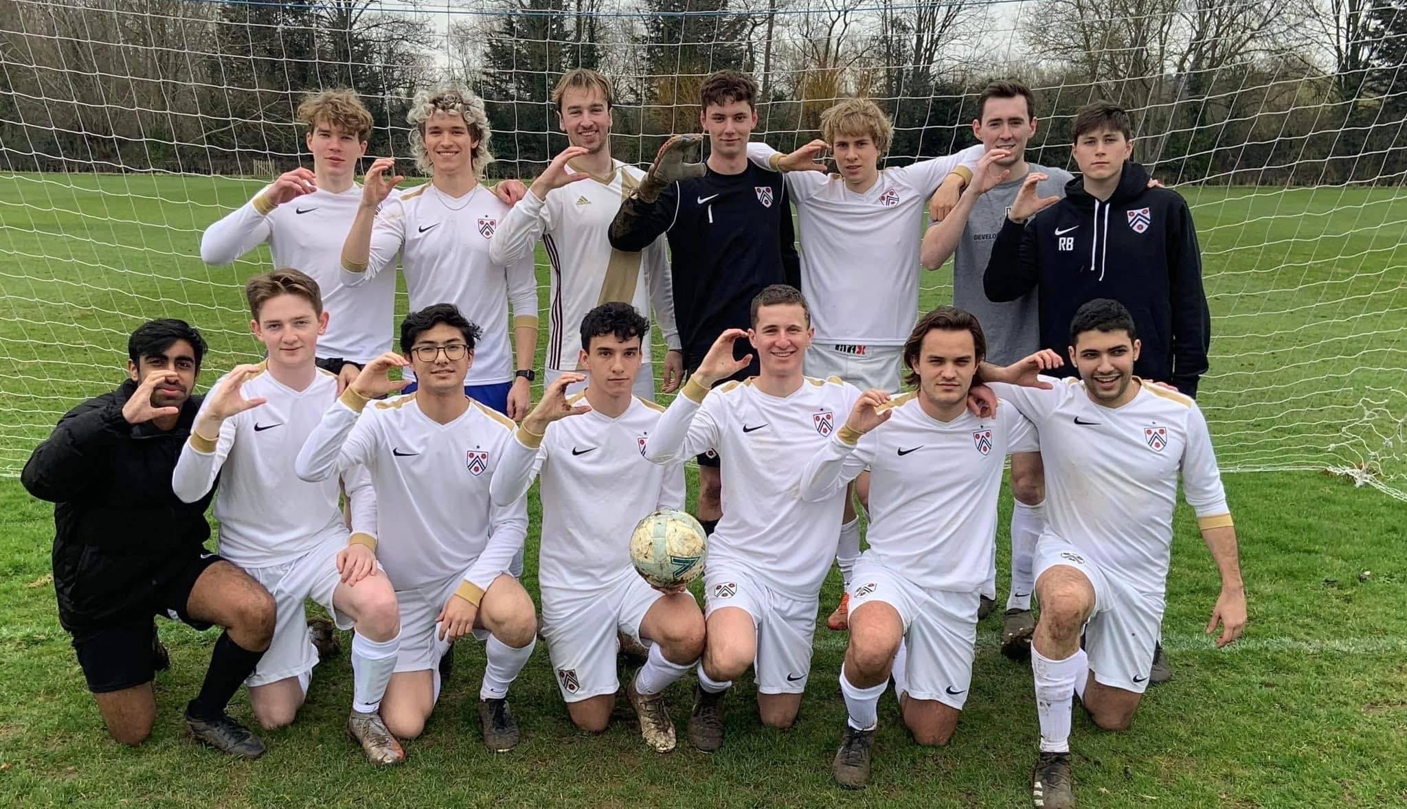 New College men's football team lined up in front of goal