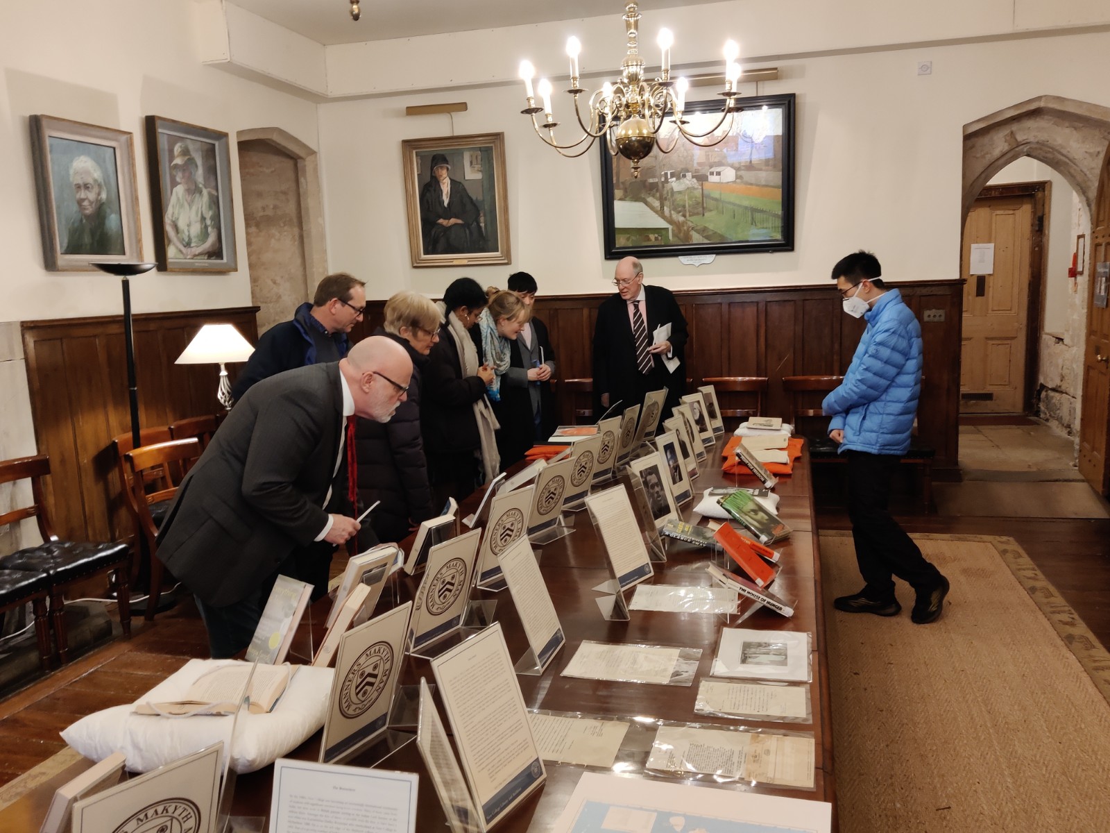 People studying the Library exhibition