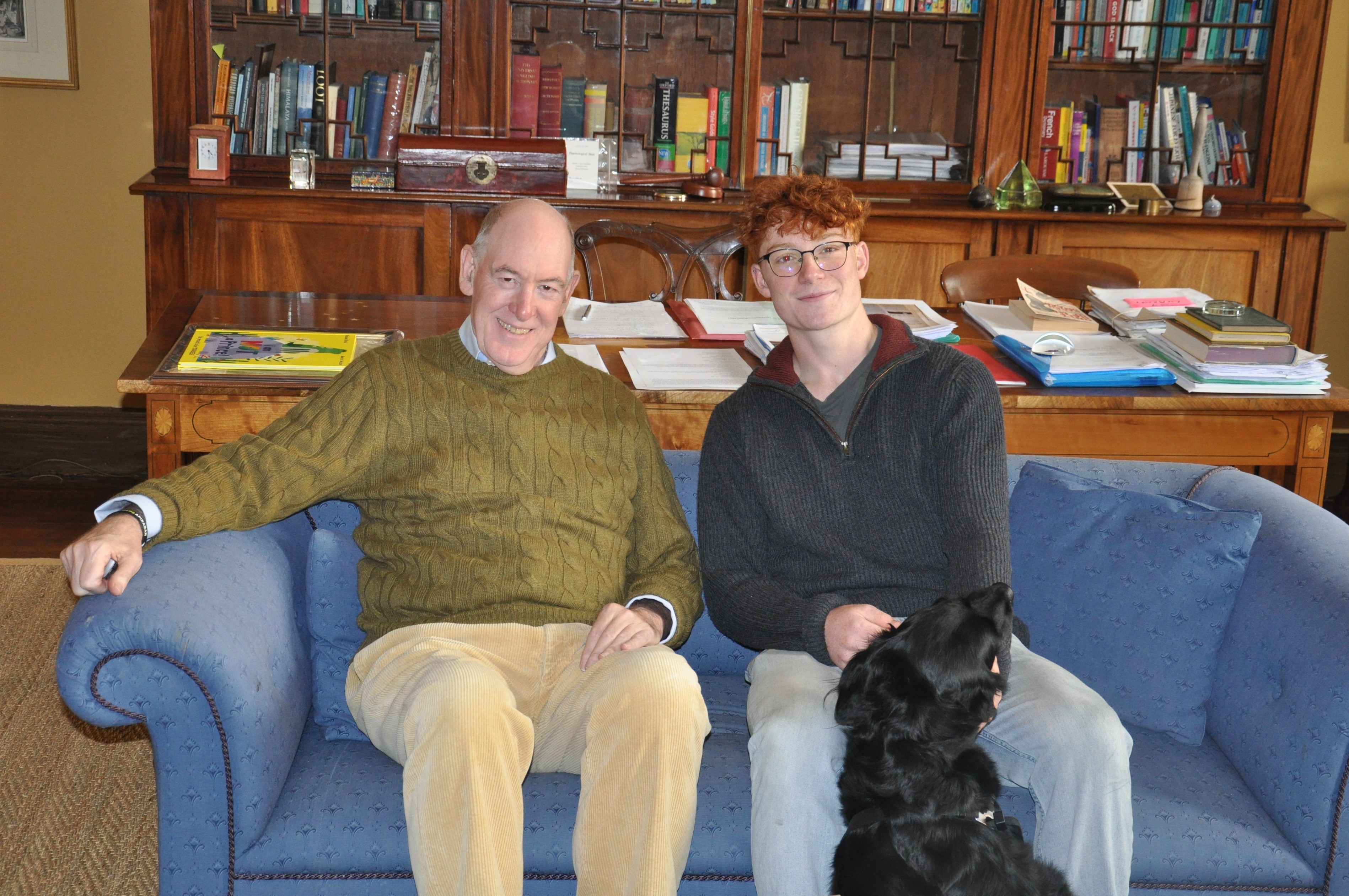 The Warden and Patrick Mayhew sitting on a sofa in the Warden's office