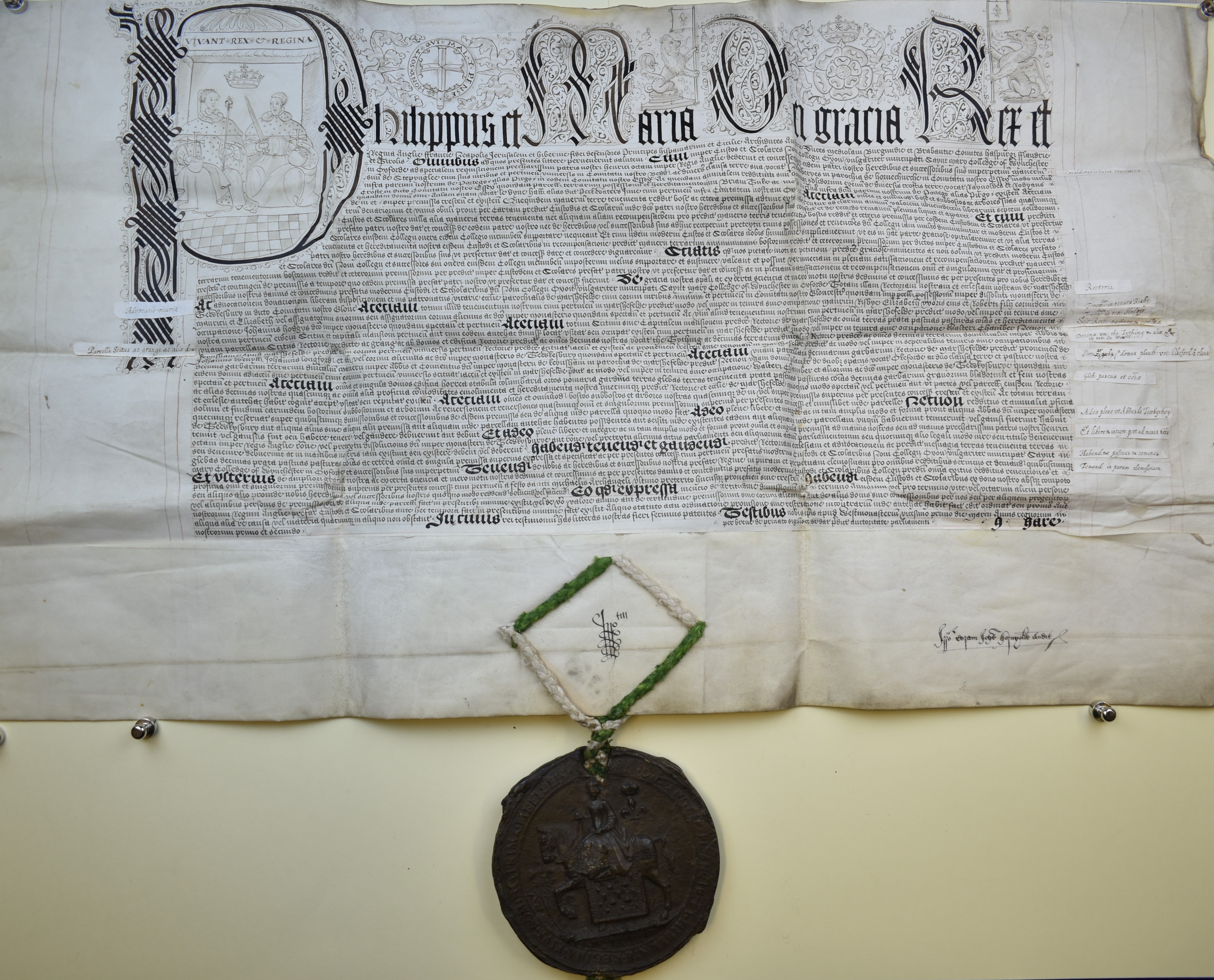 A handwritten charter of Queen Mary I and King Philip of Spain with Mary’s great seal attached.