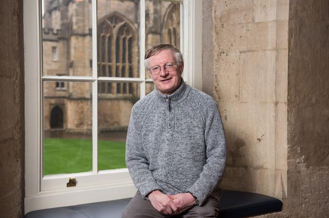 Professor Timothy Williamson sat by a window