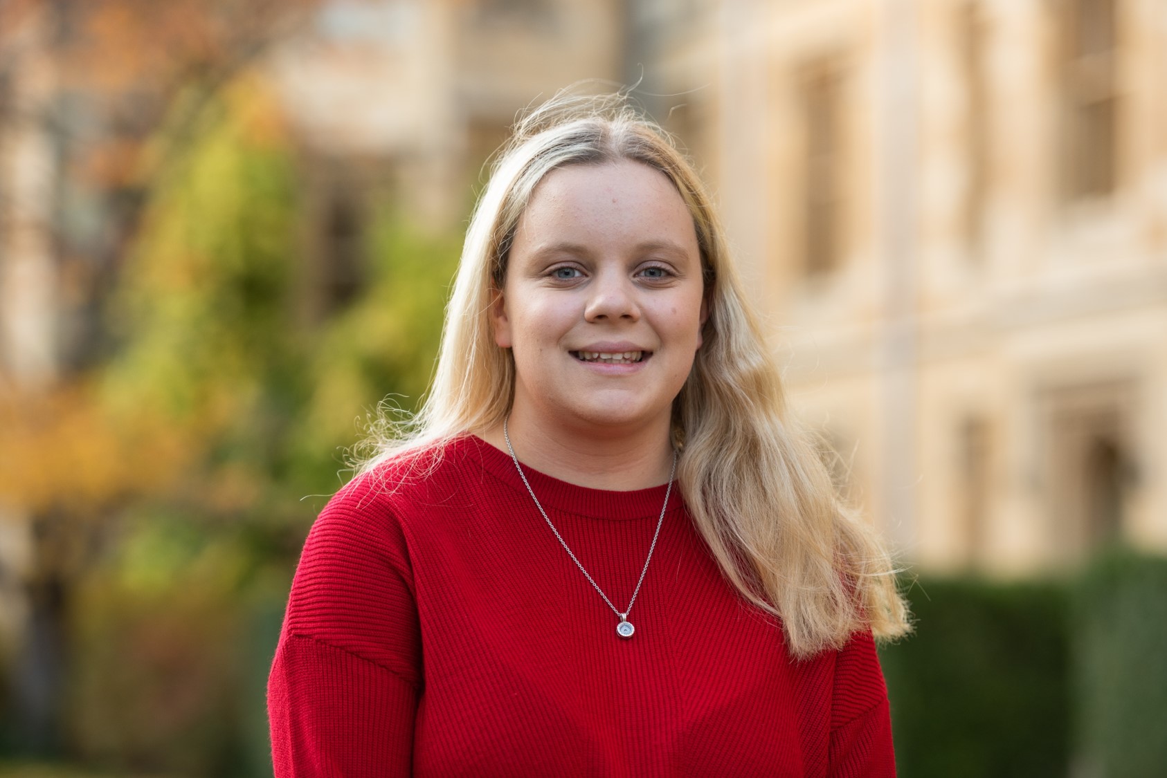 A smiling New College student