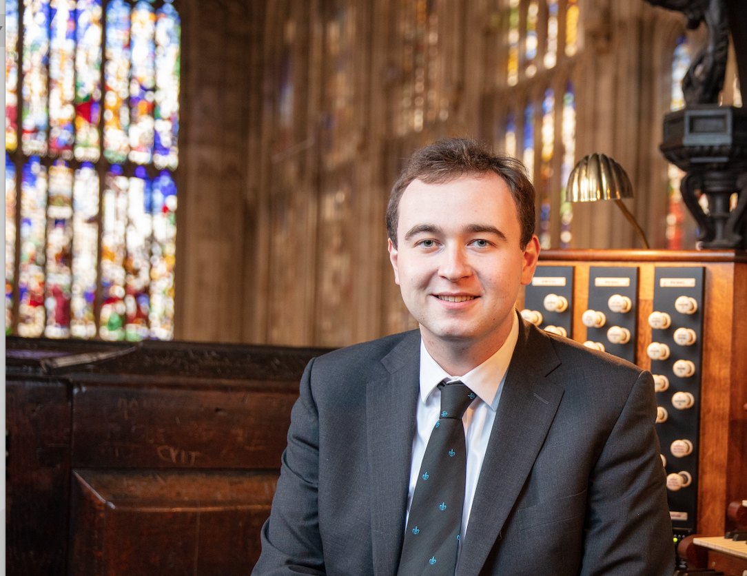 Photo of Mr McCann seated at the organ