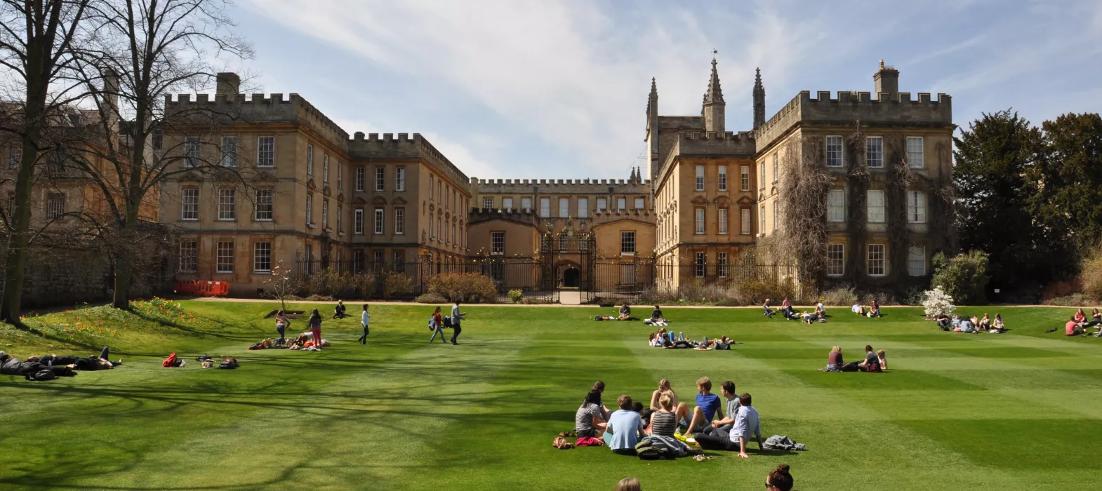 students sat in the gardens at New College