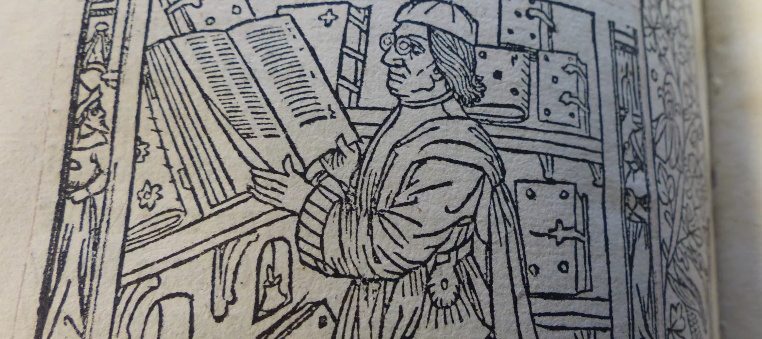 La mer des histoires, New College Library, Oxford, BT1.47.1 - scholar wearing spectacles standing at his desk