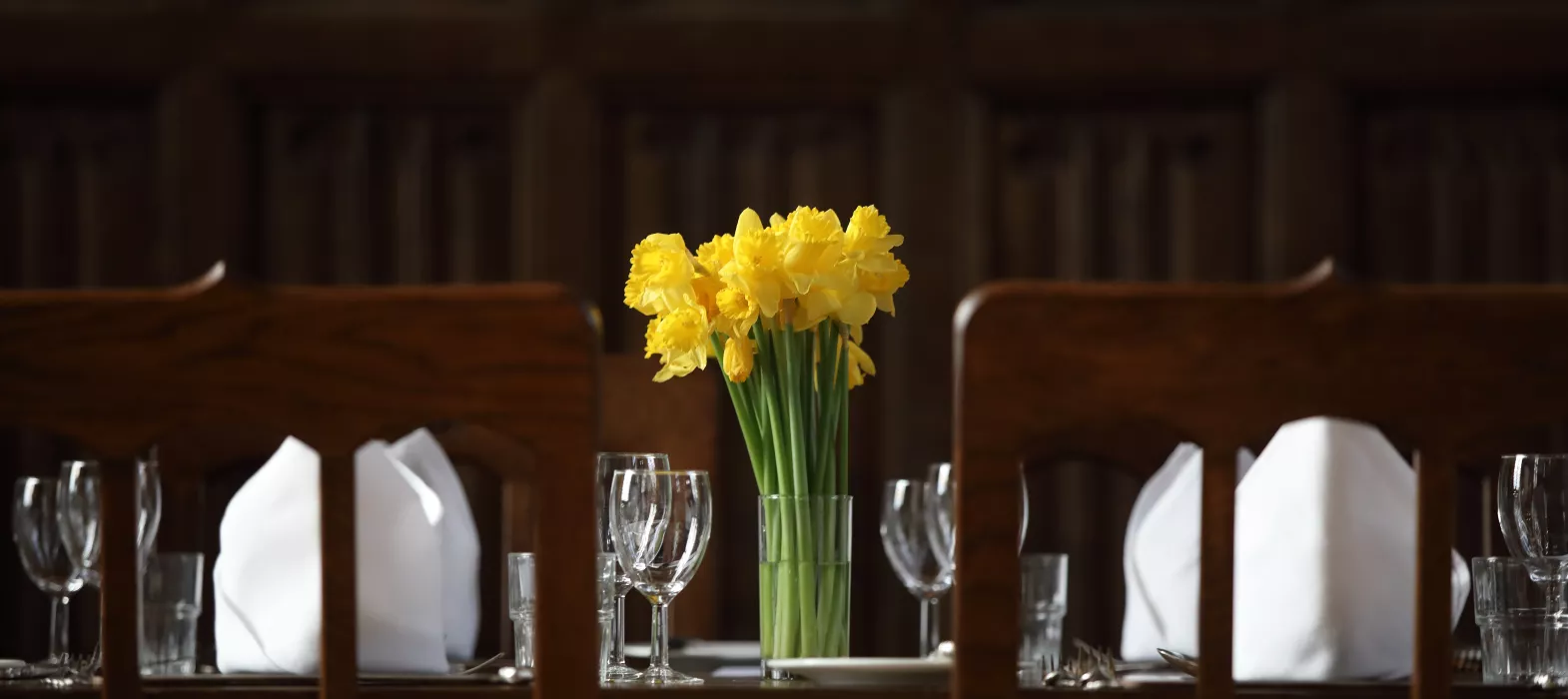 A bouquet of daffodils on High Table in our dining hall