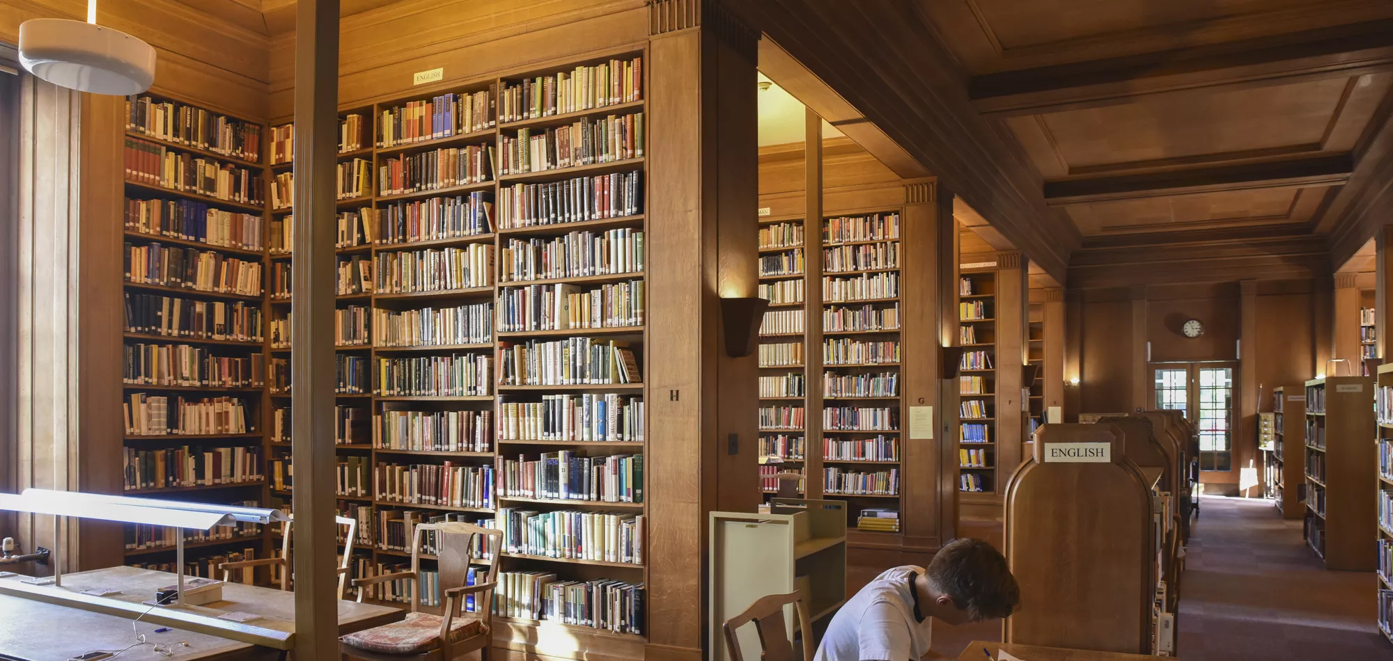 Student studying in the Upper Floor of New College Library, Oxford