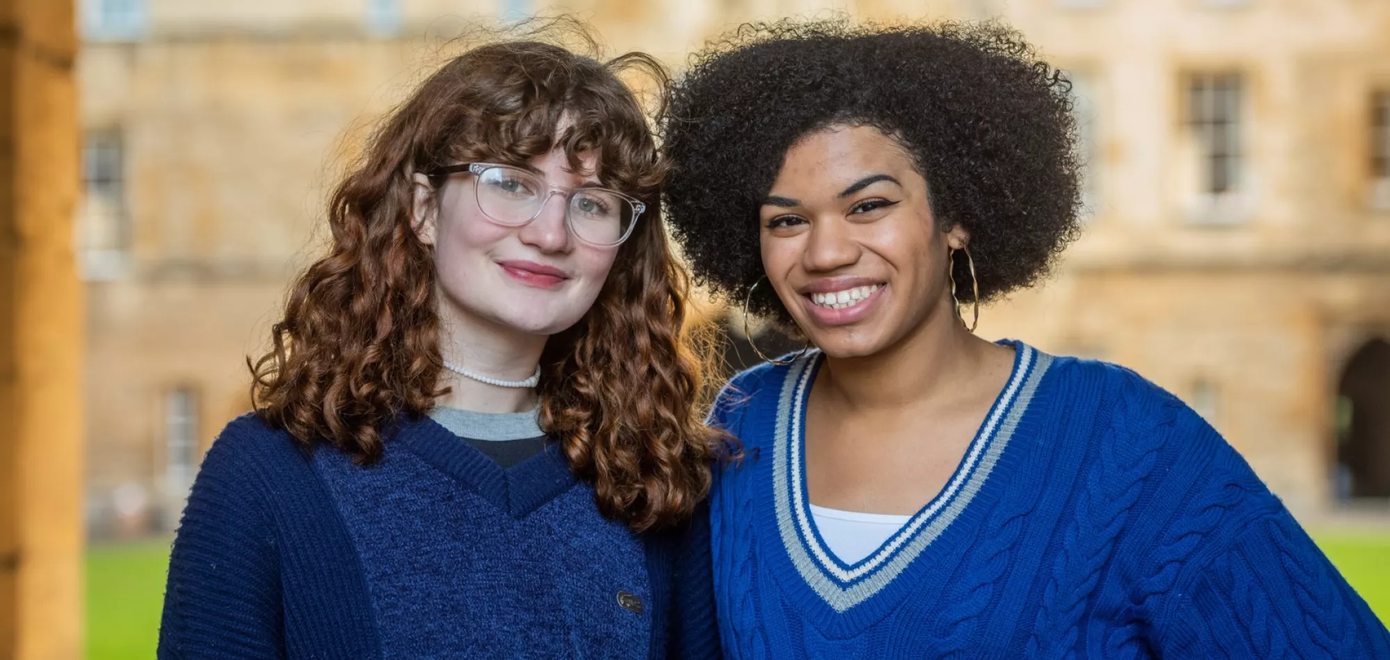 Two students smiling in Great Quad