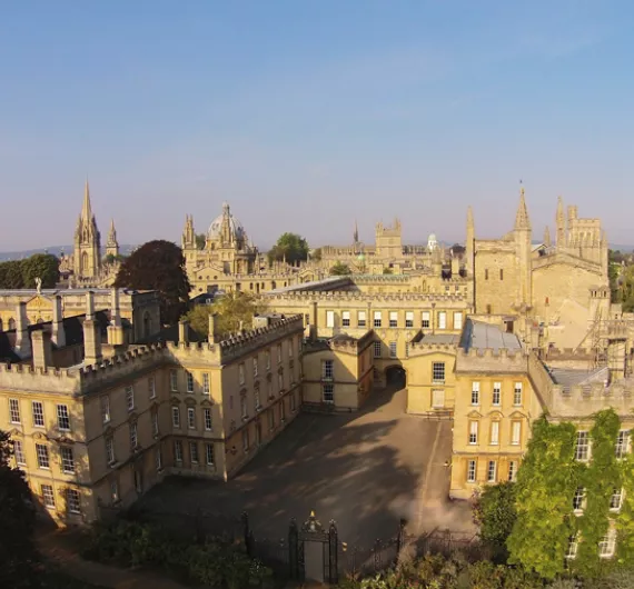 New College's 3-sided garden quad from the air, with the Oxford skyline behind