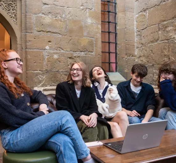 Five students laughing in the Bar