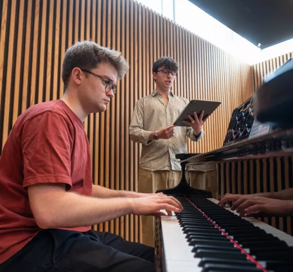 Student singing with a piano accompaniment in the Clore Music Studios