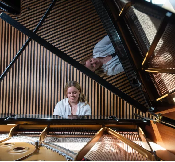 Student playing the piano in the Clore Music Studios