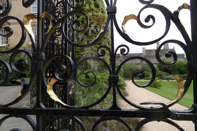 View through the garden gate to the gardens, New College, Oxford