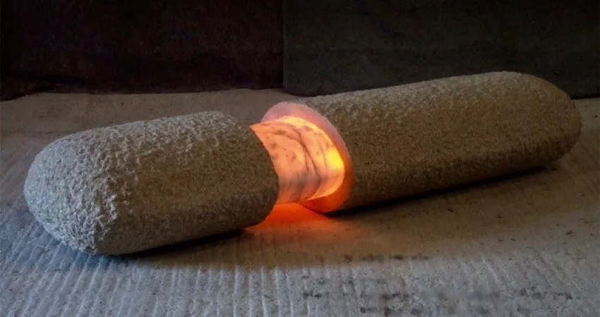 Cylindrical sculpture with break in the middle lighted up