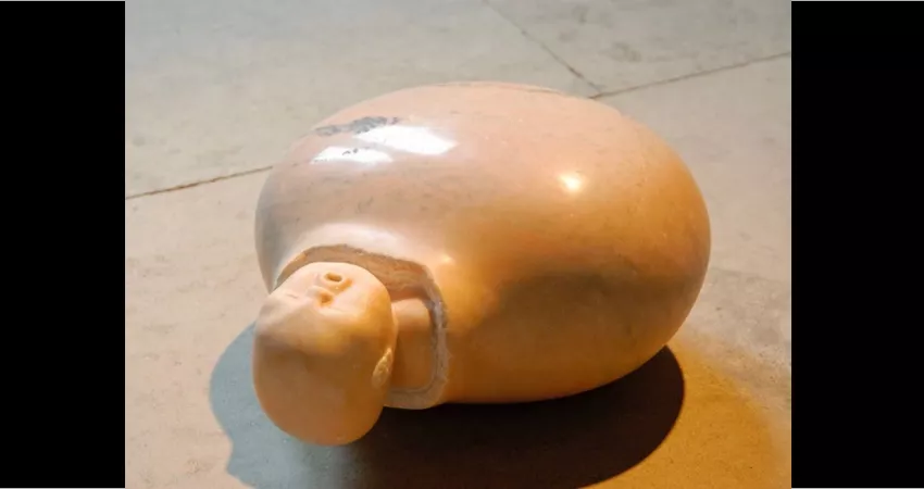 Sculpture of a swaddled baby