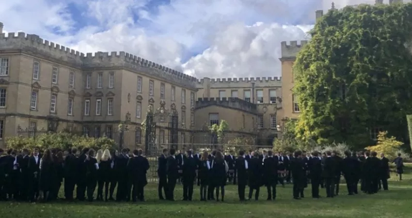 Students lining up for photographs in the Gardens