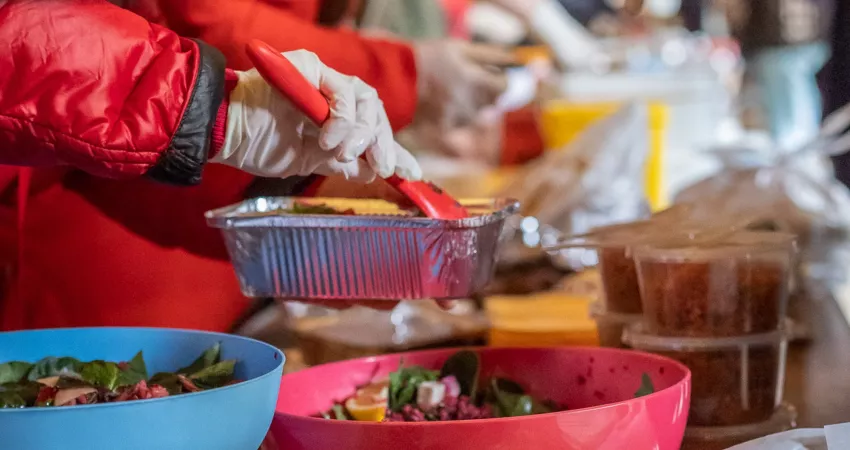 Turkish food being served from colourful containers