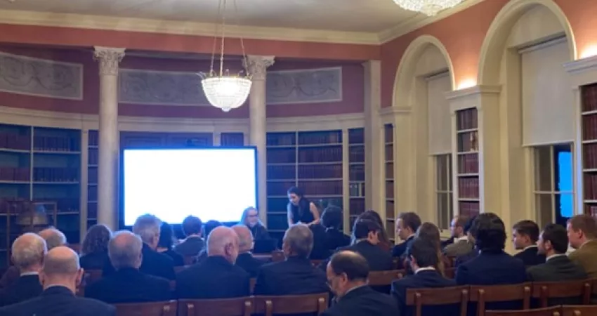 Two women about to start a lecture to an audience