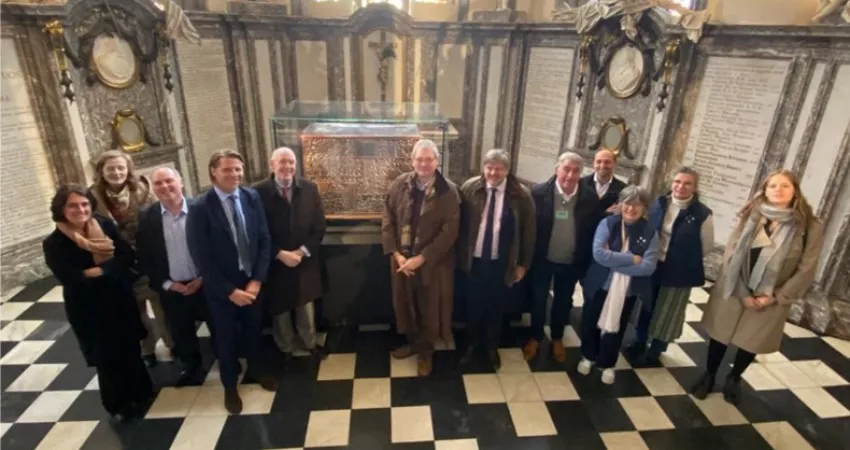 People stood in a Church by the side of the Courtrai Chest