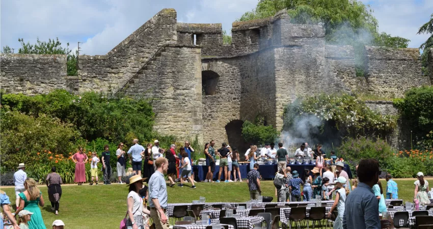 Lots of people queuing for a barbeque