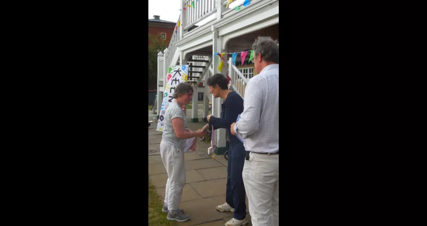 Prof Irene Tracey hands out a medal