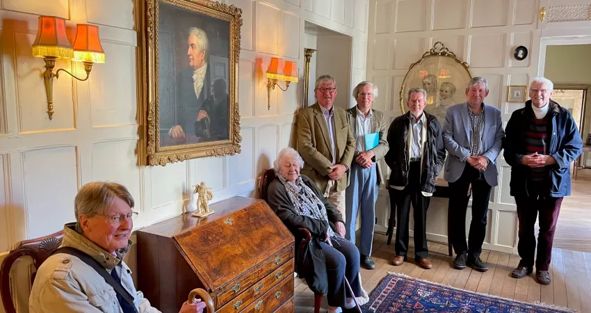Members of the Sydney Smith Association gather in the Warden's Lodgings to view his portrait