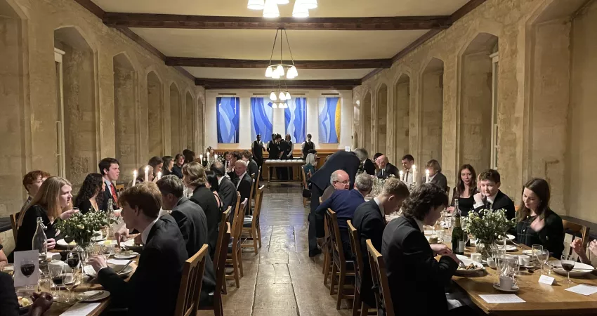 Guests sit for dinner in the Founder’s Library