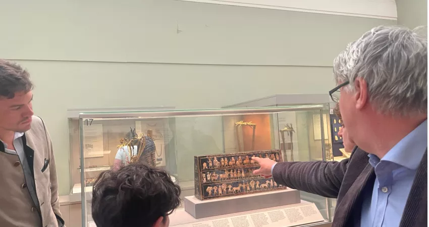 Professor Meadows examines the Ur exhibits in with MCR members