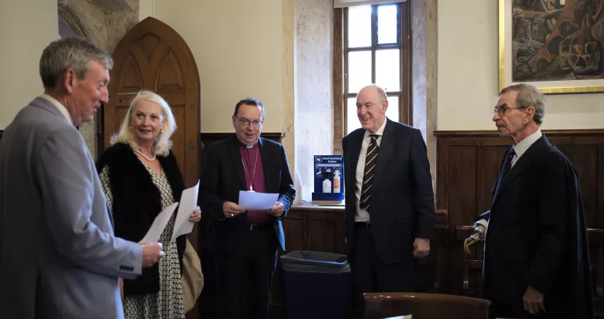 Guests enjoying the exhibition of manuscripts relating to William of Wykeham