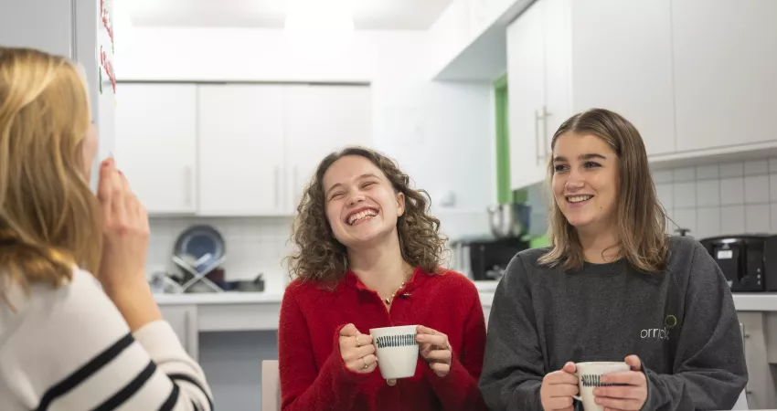 Two students enjoy a cup of tea